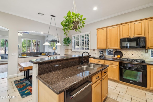 kitchen featuring visible vents, black appliances, ornamental molding, a sink, and decorative backsplash