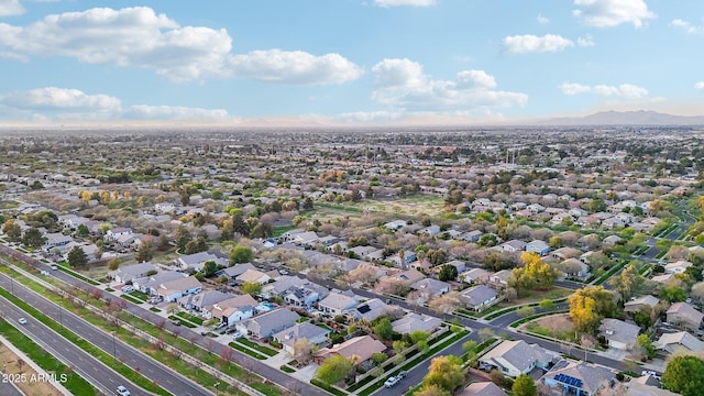 birds eye view of property with a mountain view and a residential view