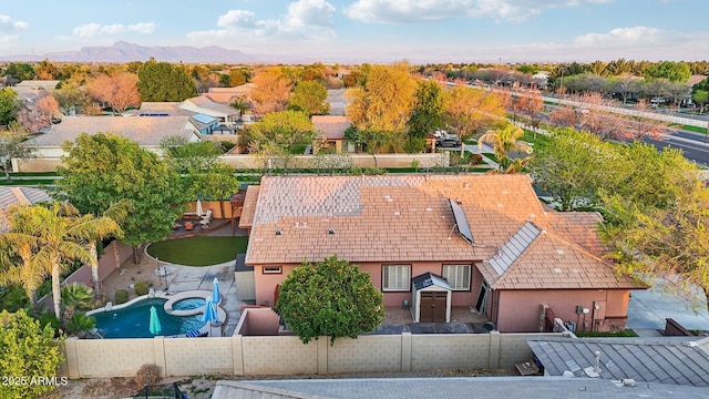 birds eye view of property with a mountain view