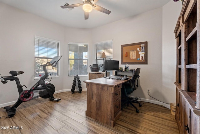 home office featuring ceiling fan and a healthy amount of sunlight