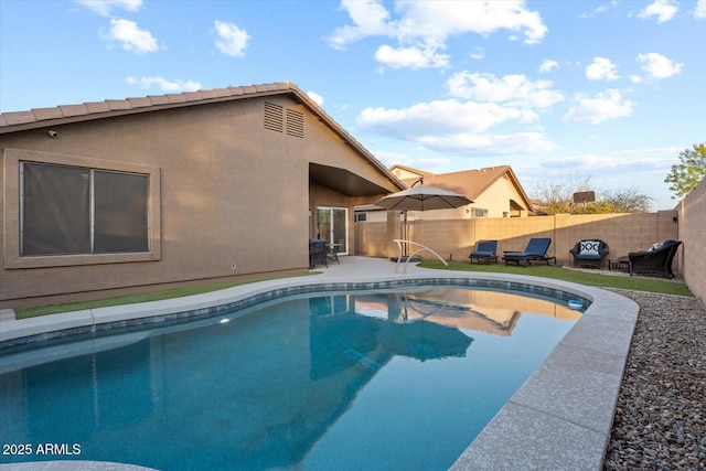 view of pool featuring a patio area