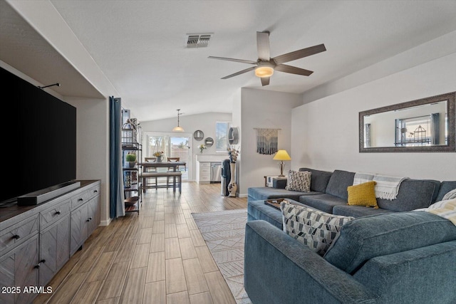 living room with vaulted ceiling and ceiling fan