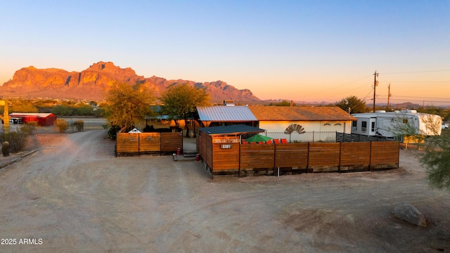 view of dirt / gravel driveway with a mountain view