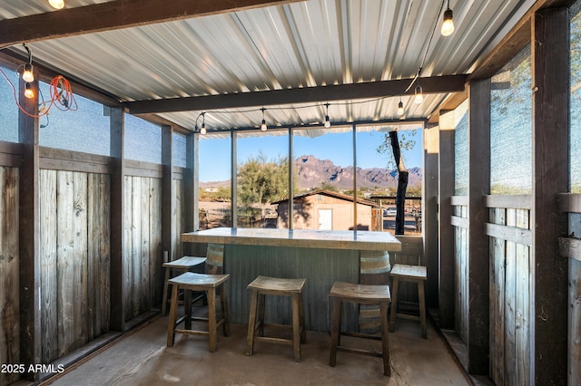 sunroom with a mountain view