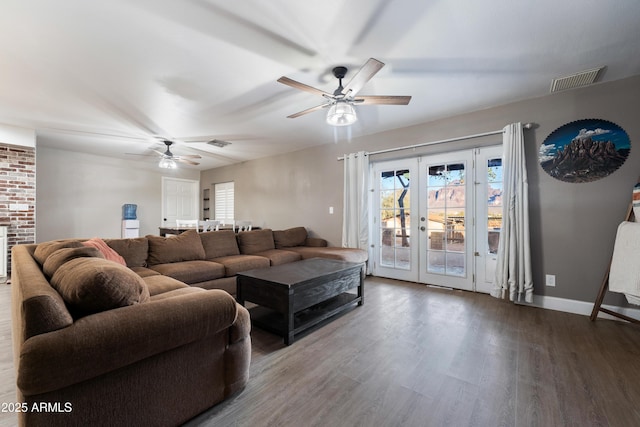 living room featuring a ceiling fan, wood finished floors, baseboards, and french doors