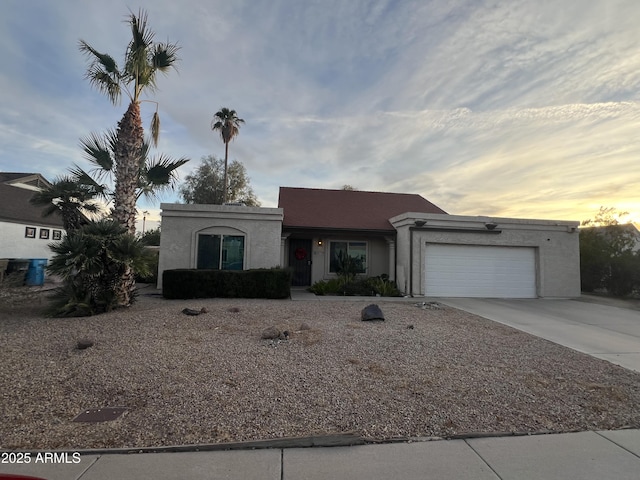 ranch-style house featuring a garage