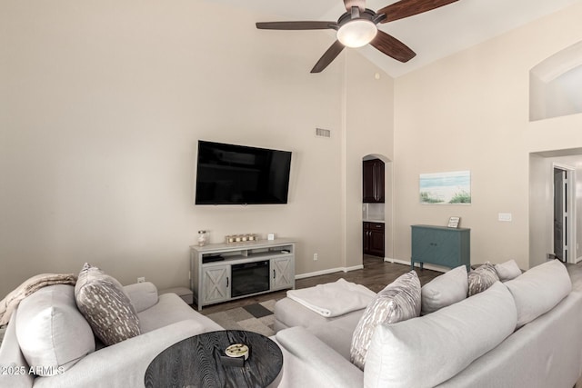 4137 E Stanford Ave, Gilbert, AZ 85234 - living area with arched walkways, a ceiling fan, and high vaulted ceiling
