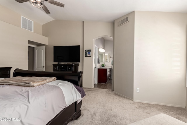 4137 E Stanford Ave, Gilbert, AZ 85234 - bedroom featuring light colored carpet, arched walkways, high vaulted ceiling, ensuite bathroom, and ceiling fan
