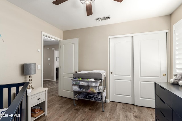 4137 E Stanford Ave, Gilbert, AZ 85234 - bedroom with light wood finished floors, a closet, and a ceiling fan