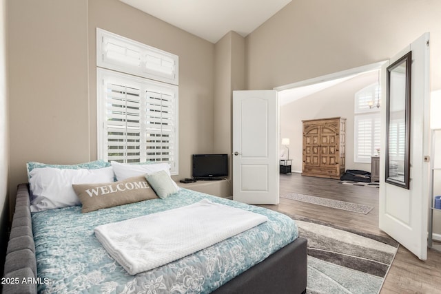 4137 E Stanford Ave, Gilbert, AZ 85234 - bedroom with wood finished floors and vaulted ceiling