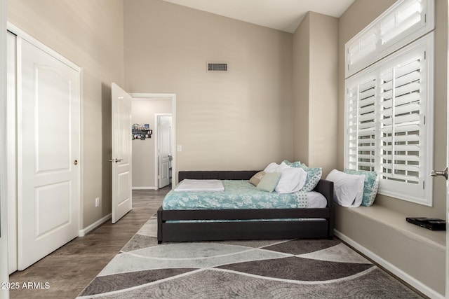 4137 E Stanford Ave, Gilbert, AZ 85234 - bedroom with wood finished floors and baseboards