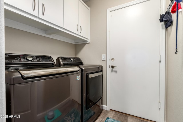 4137 E Stanford Ave, Gilbert, AZ 85234 - washroom with independent washer and dryer, cabinet space, and light wood-style floors