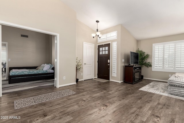 4137 E Stanford Ave, Gilbert, AZ 85234 - foyer entrance with a chandelier, wood finished floors, healthy amount of natural light, and high vaulted ceiling