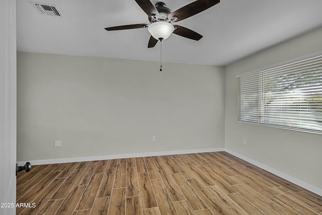 unfurnished room with ceiling fan and light hardwood / wood-style flooring