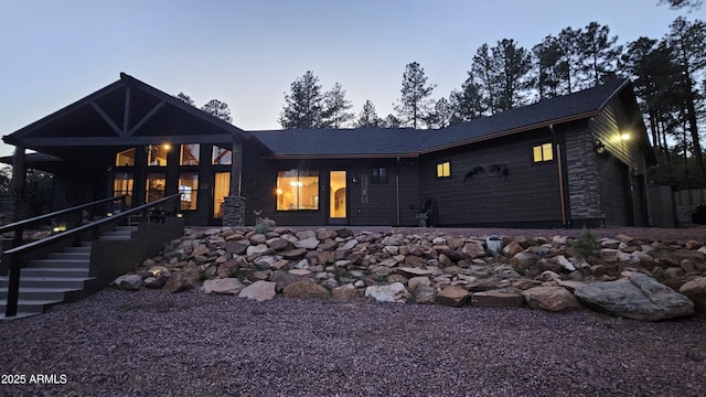 4990 N Pine Creek Canyon Dr, Pine, AZ 85544 - rear view of house with a garage and stone siding