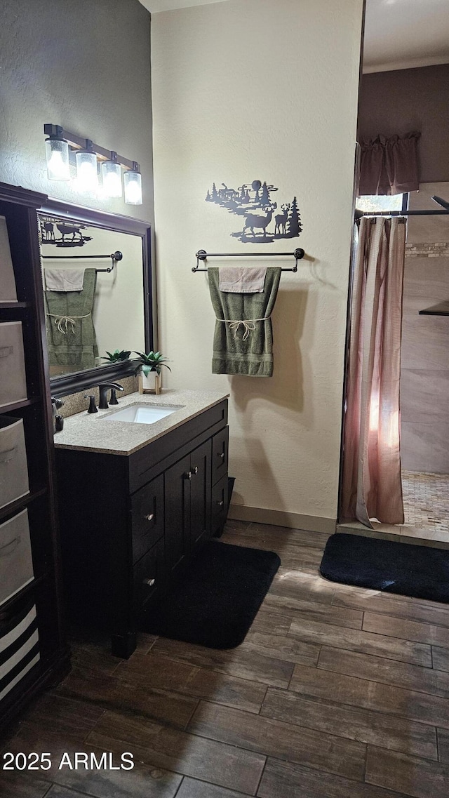 4990 N Pine Creek Canyon Dr, Pine, AZ 85544 - full bath with wood finished floors, vanity, and a shower