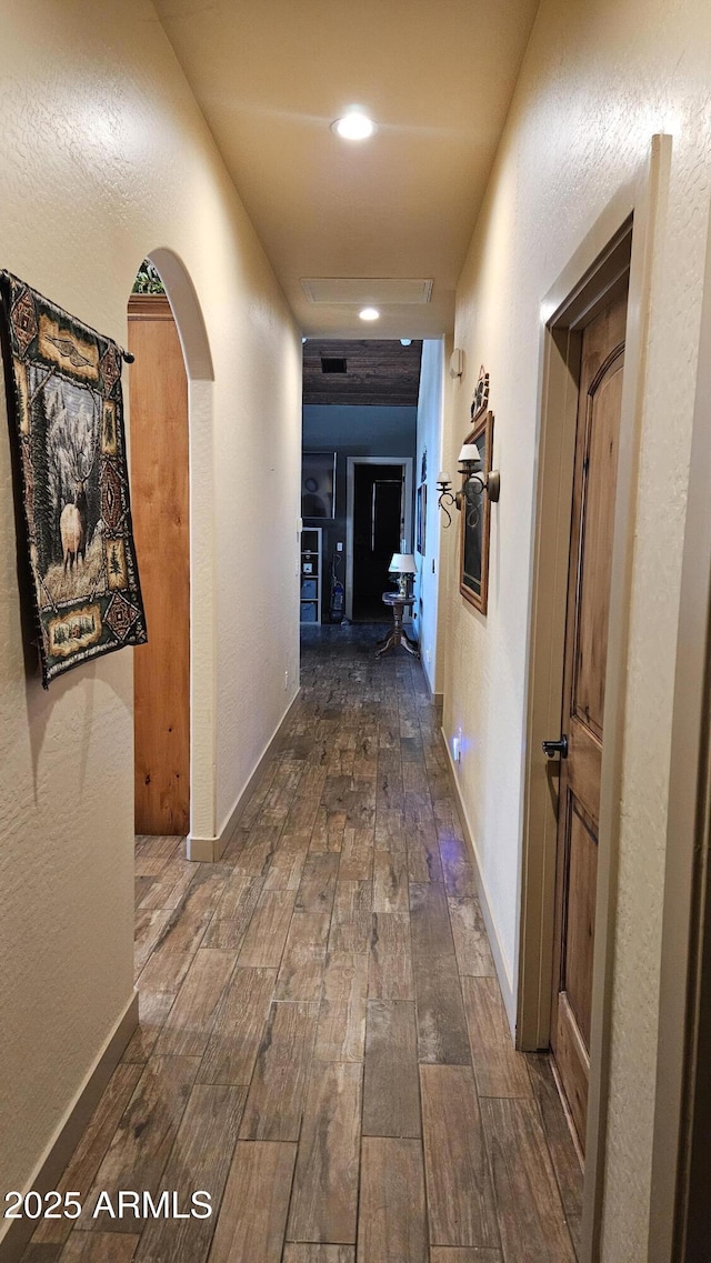 4990 N Pine Creek Canyon Dr, Pine, AZ 85544 - hallway featuring dark wood-style floors, arched walkways, and recessed lighting