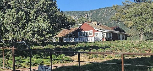 4990 N Pine Creek Canyon Dr, Pine, AZ 85544 - exterior space with a chimney and a view of trees