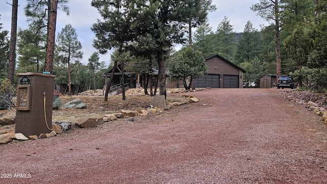4990 N Pine Creek Canyon Dr, Pine, AZ 85544 - view of front of home with a storage shed and a detached garage