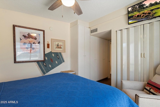 16819 E Gunsight Dr Unit A31, Fountain Hills, AZ 85268 - bedroom with ceiling fan and a textured ceiling