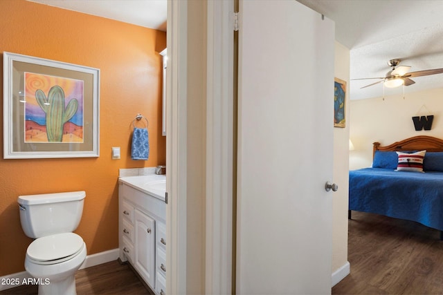 16819 E Gunsight Dr Unit A31, Fountain Hills, AZ 85268 - ensuite bathroom featuring wood finished floors, vanity, and a ceiling fan