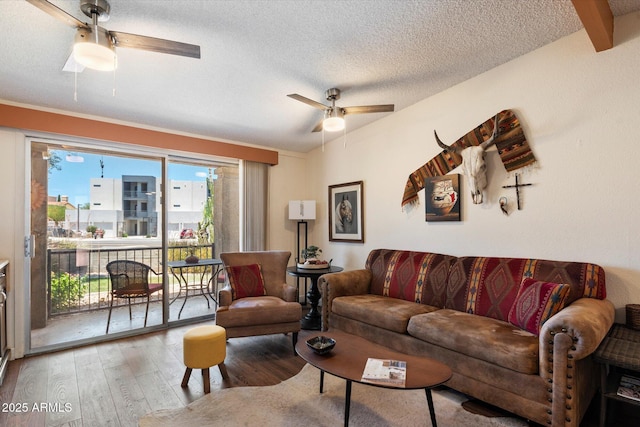 16819 E Gunsight Dr Unit A31, Fountain Hills, AZ 85268 - living area with ceiling fan, wood finished floors, and a textured ceiling