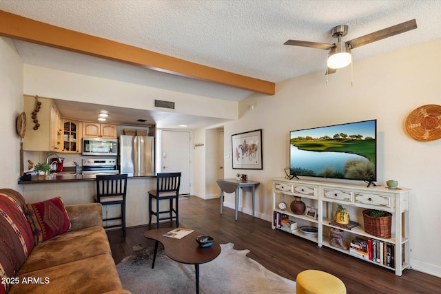 16819 E Gunsight Dr Unit A31, Fountain Hills, AZ 85268 - living area featuring dark wood-type flooring, a textured ceiling, beam ceiling, and ceiling fan