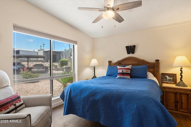 16819 E Gunsight Dr Unit A31, Fountain Hills, AZ 85268 - bedroom featuring wood finished floors, a textured ceiling, and a ceiling fan