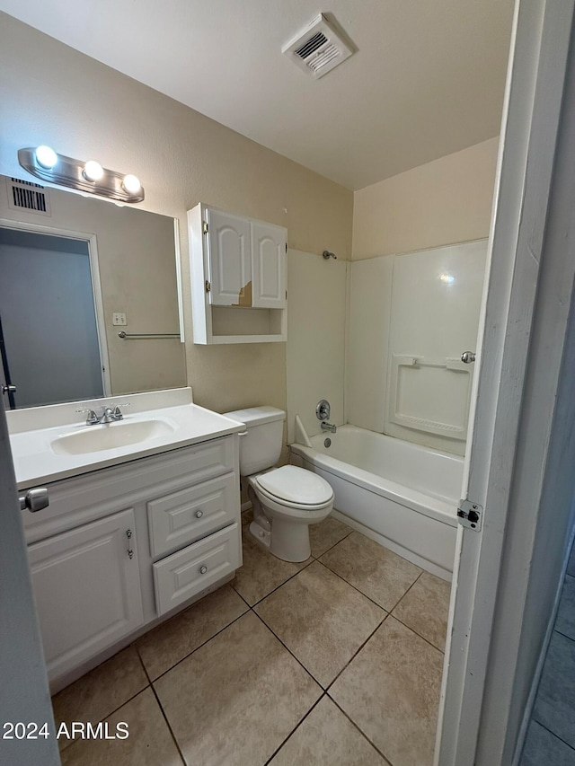 full bathroom with tile patterned floors, shower / tub combination, vanity, and toilet