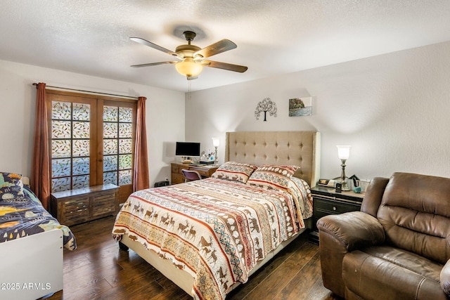 bedroom with dark wood finished floors, a ceiling fan, and a textured ceiling