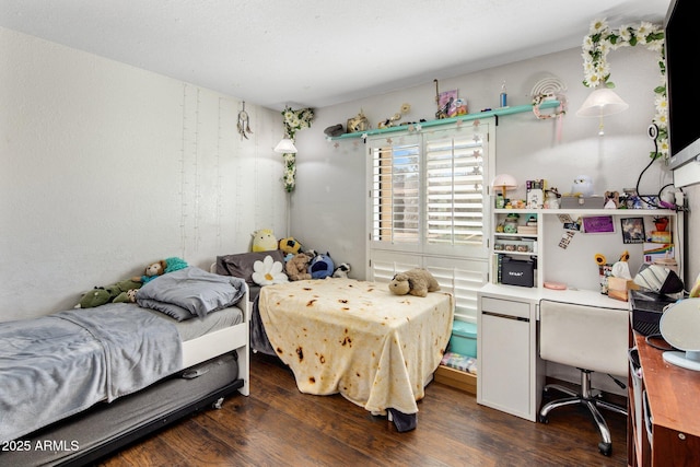 bedroom with dark wood-style floors