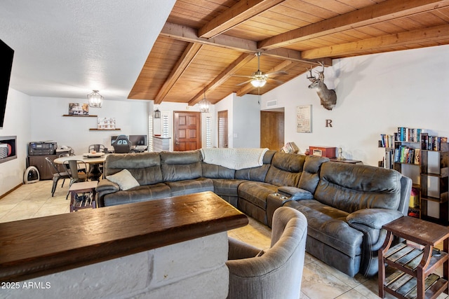 living area featuring lofted ceiling with beams, light tile patterned flooring, a chandelier, and wooden ceiling