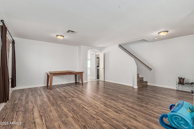 8939 W Villa Rita Dr, Peoria, AZ 85382 - basement featuring arched walkways, stairway, and wood finished floors