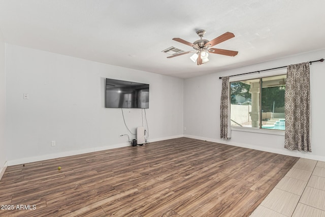 8939 W Villa Rita Dr, Peoria, AZ 85382 - unfurnished living room with a ceiling fan and wood finished floors