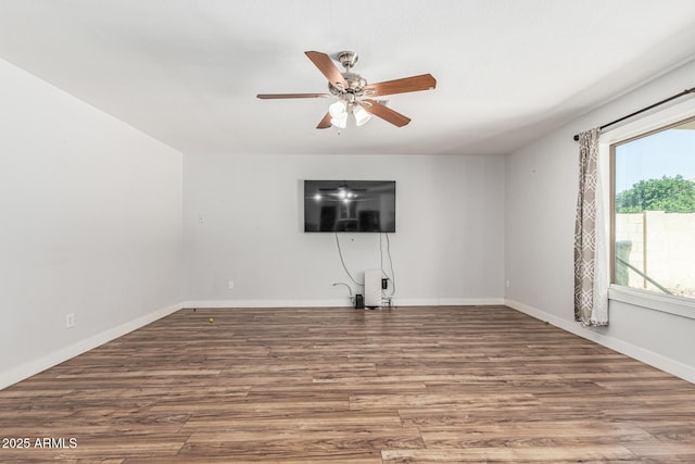 8939 W Villa Rita Dr, Peoria, AZ 85382 - unfurnished living room with a ceiling fan and wood finished floors