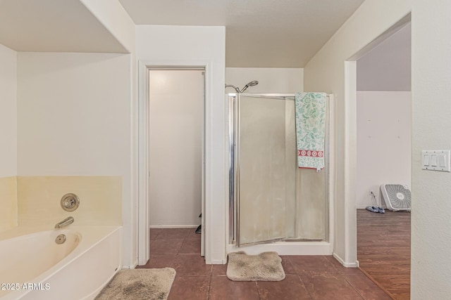 8939 W Villa Rita Dr, Peoria, AZ 85382 - bathroom featuring a stall shower, a bath, and tile patterned flooring