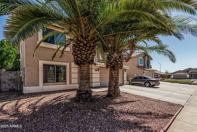 8939 W Villa Rita Dr, Peoria, AZ 85382 - view of front of property featuring concrete driveway and stucco siding