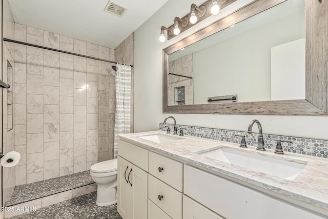 8939 W Villa Rita Dr, Peoria, AZ 85382 - bathroom featuring double vanity, a tile shower, and tile patterned floors