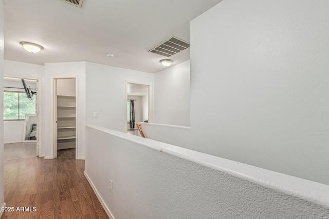 8939 W Villa Rita Dr, Peoria, AZ 85382 - hallway featuring wood finished floors and an upstairs landing