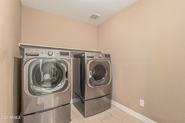 8939 W Villa Rita Dr, Peoria, AZ 85382 - washroom with washing machine and dryer and baseboards