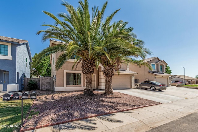 8939 W Villa Rita Dr, Peoria, AZ 85382 - view of front of house featuring driveway and stucco siding