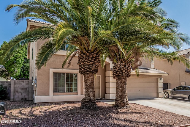 8939 W Villa Rita Dr, Peoria, AZ 85382 - view of front of home with concrete driveway, stucco siding, and a garage