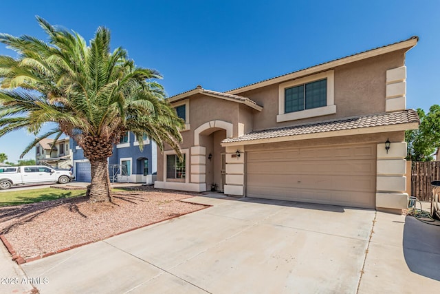 8939 W Villa Rita Dr, Peoria, AZ 85382 - view of front facade featuring stucco siding, concrete driveway, a garage, and a tile roof