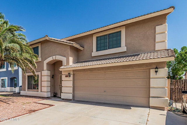 8939 W Villa Rita Dr, Peoria, AZ 85382 - view of front of property with a tiled roof, driveway, and stucco siding