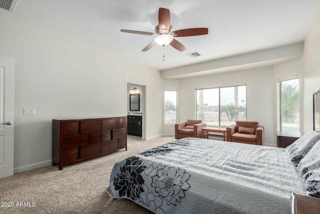 bedroom featuring light carpet, baseboards, and visible vents