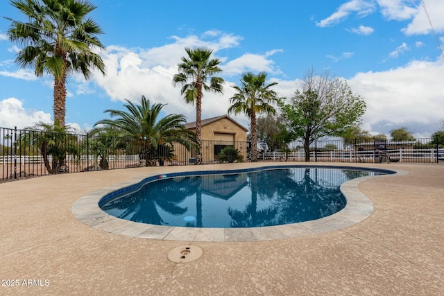 view of pool featuring fence, a fenced in pool, and a patio