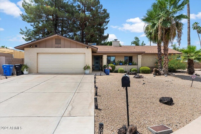 ranch-style house featuring a garage