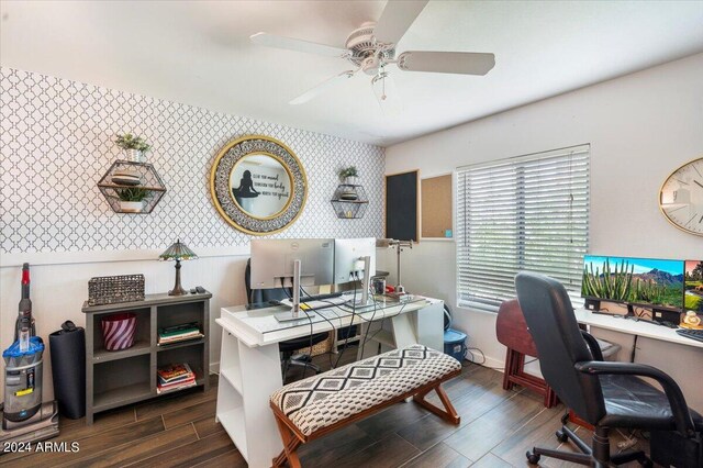 home office with ceiling fan and dark hardwood / wood-style flooring