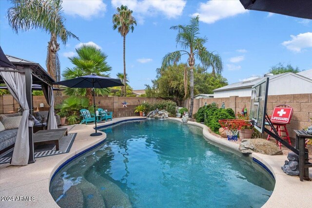 view of swimming pool with a gazebo