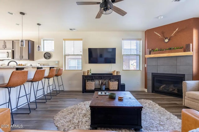 2465 W Clement Cir, Flagstaff, AZ 86001 - living area with plenty of natural light, wood finished floors, and baseboards